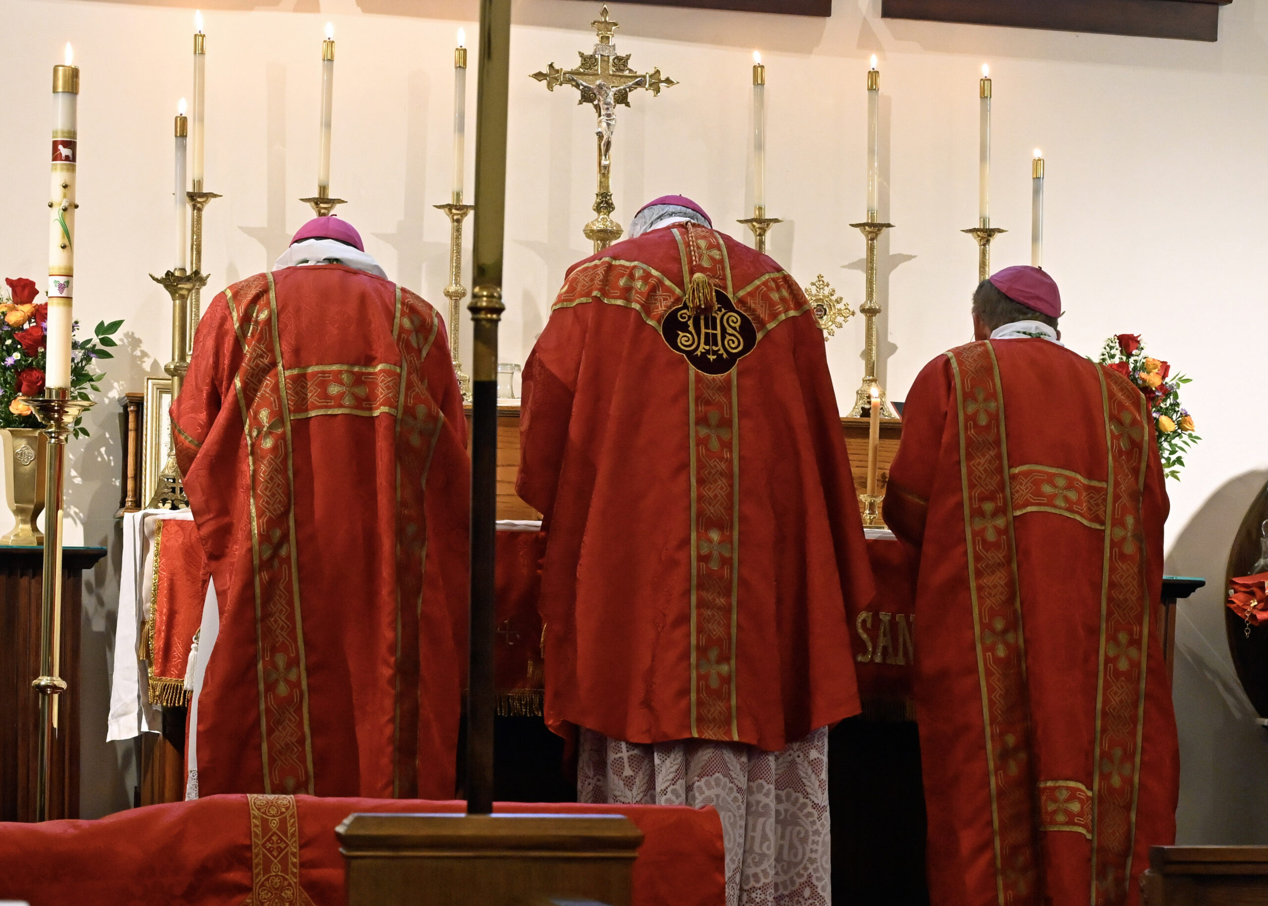 Bishops at altar.